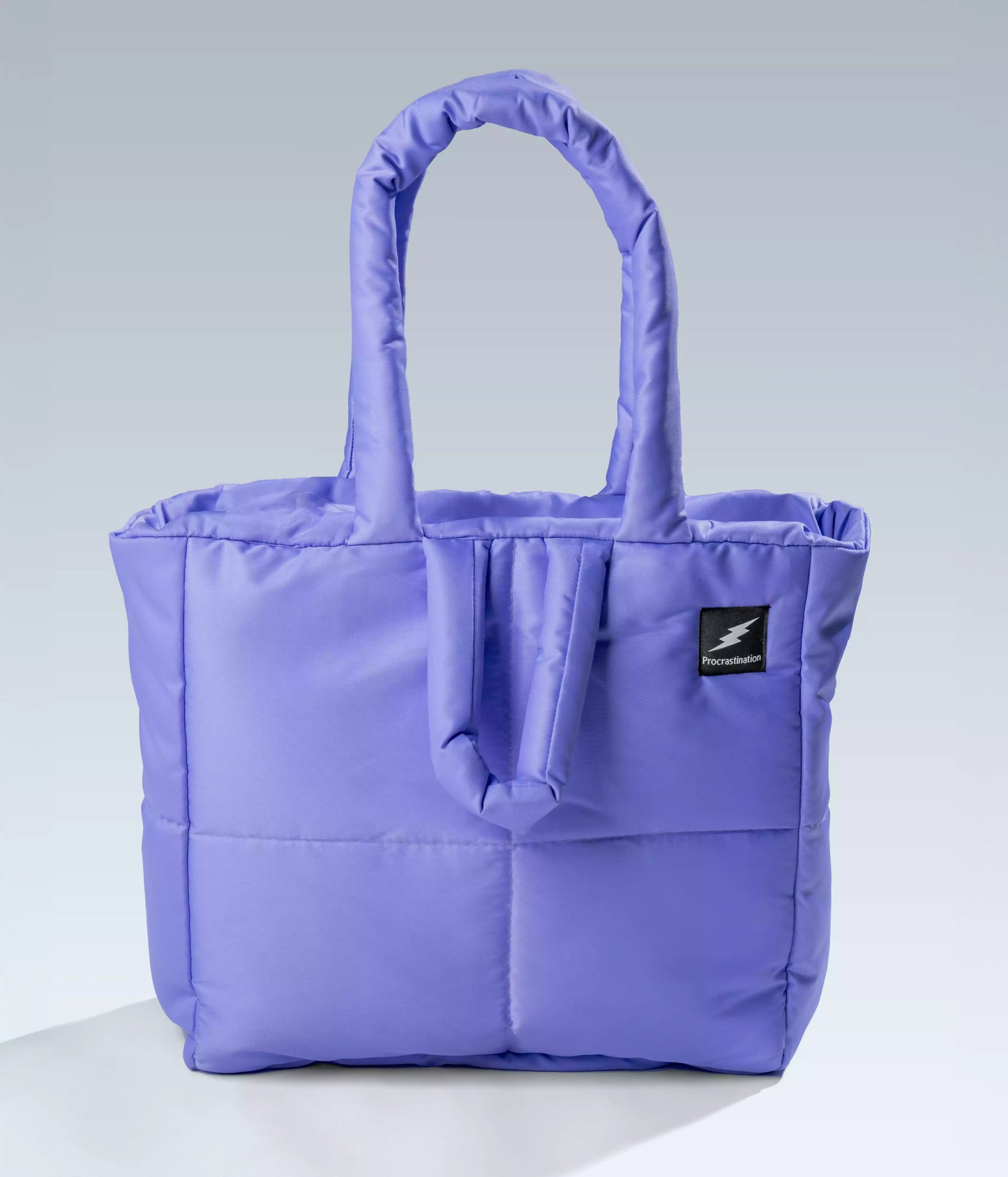 Purple quilted puffer tote bag front